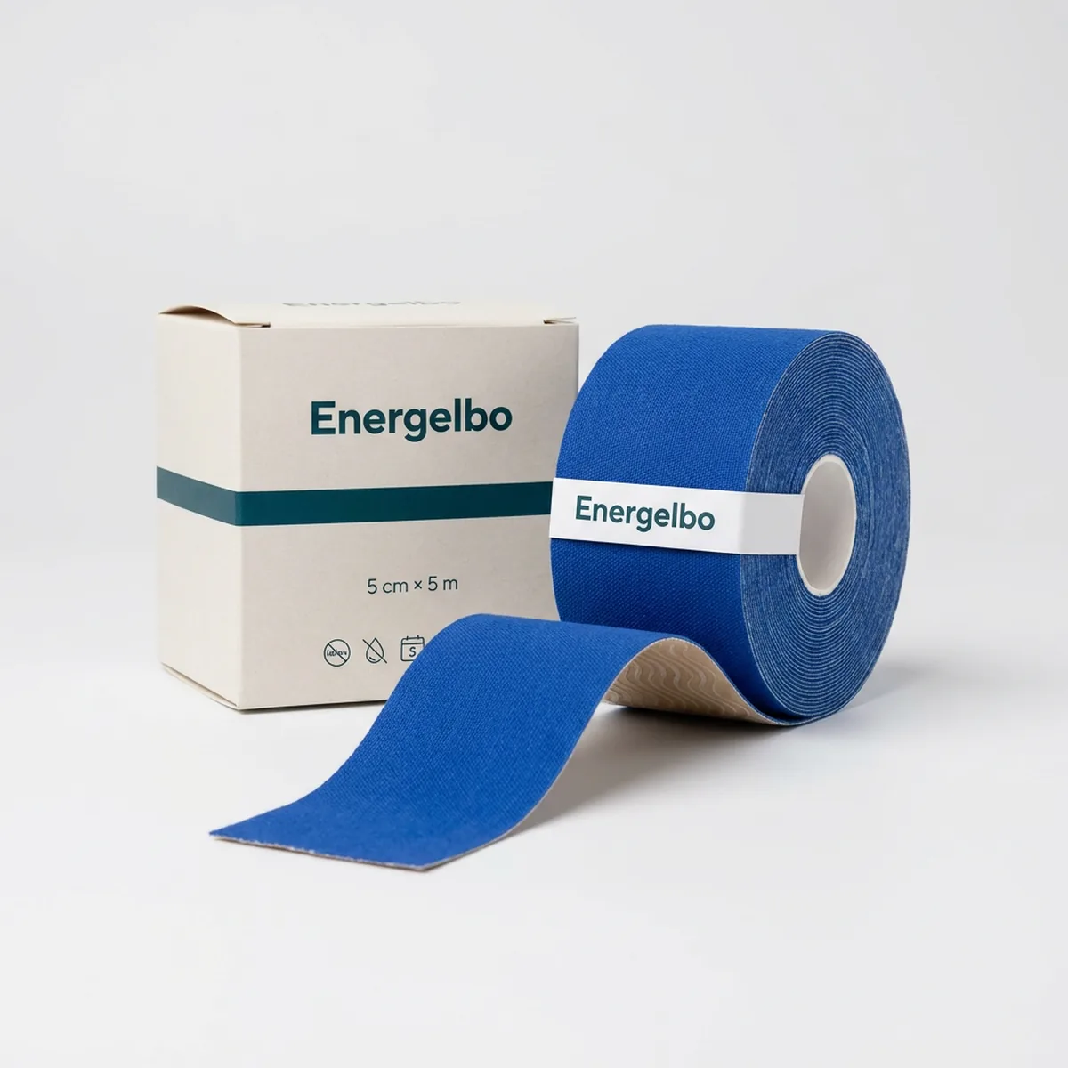 Single roll of royal blue Energelbo kinesiology tape, 5 cm wide, standing upright with a length of tape unrolled towards the camera