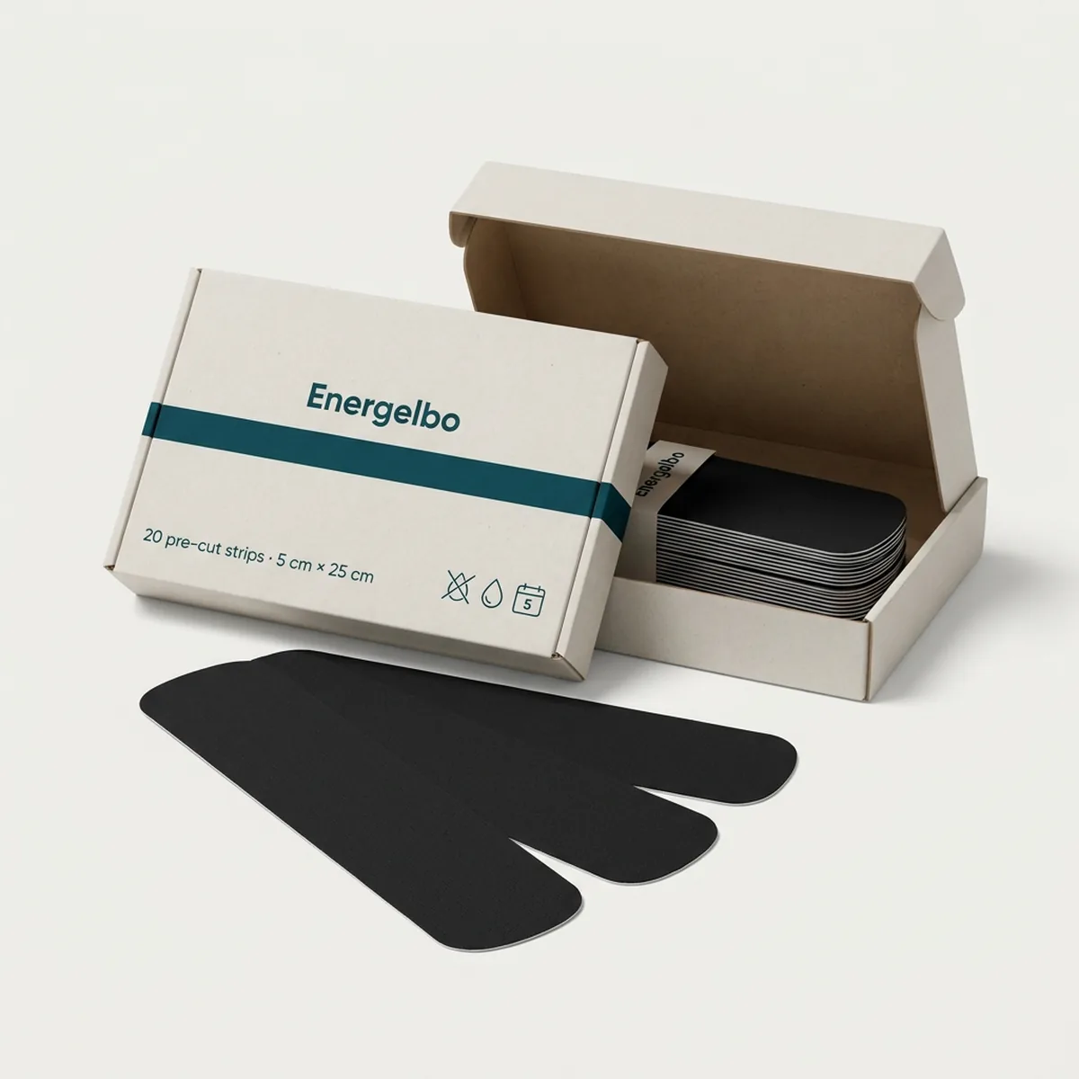 Open Energelbo carton with a stack of 20 pre-cut black tape strips and three strips fanned out in front showing their rounded corners